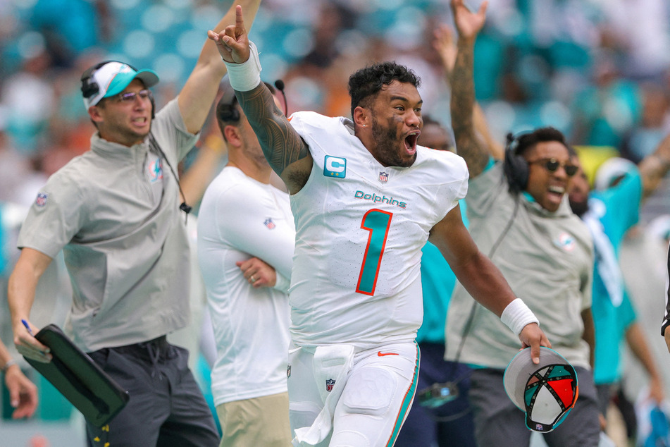 Miami Dolphins quarterback Tua Tagovailoa reacts after a touchdown by wide receiver Robbie Chosen against the Denver Broncos in the fourth quarter at Hard Rock Stadium.