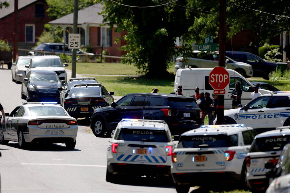 Cops were met with gunfire at the address as they arrived to serve a warrant for a man wanted over possession of a firearm.