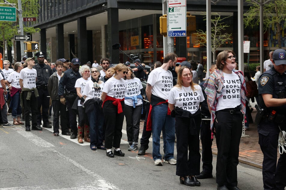 Scores of people gathering under the banner of Jewish Voice for Peace were arrested in New York Ci for protesting continued US support for Israel.