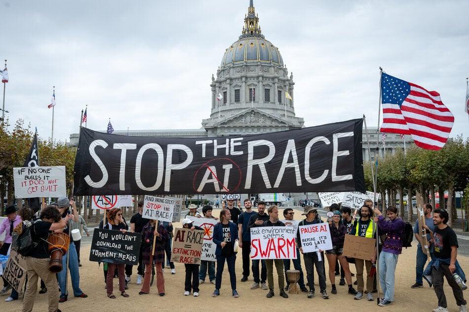 Protesters at a "Stop the AI Race" demonstration call for a slowdown in the development of advanced AI systems. Fears are growing over AI's rapid rise in light of recent loss-of-control incidents.