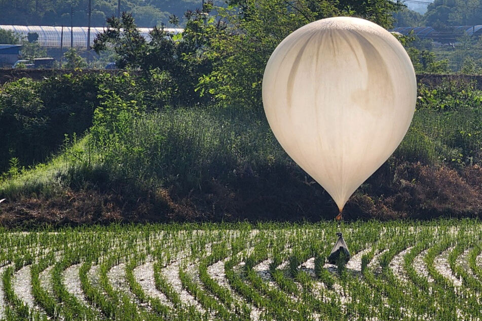 North Korea has been accused by South Korea of launching hundreds of balloons filled with poop and trash over the border.