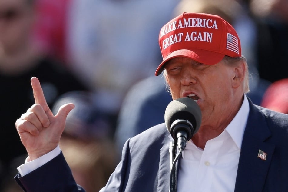 Presumptive Republican presidential nominee Donald Trump is due to rally in Michigan and Wisconsin on Tuesday as he looks to drum up support in key swing states.