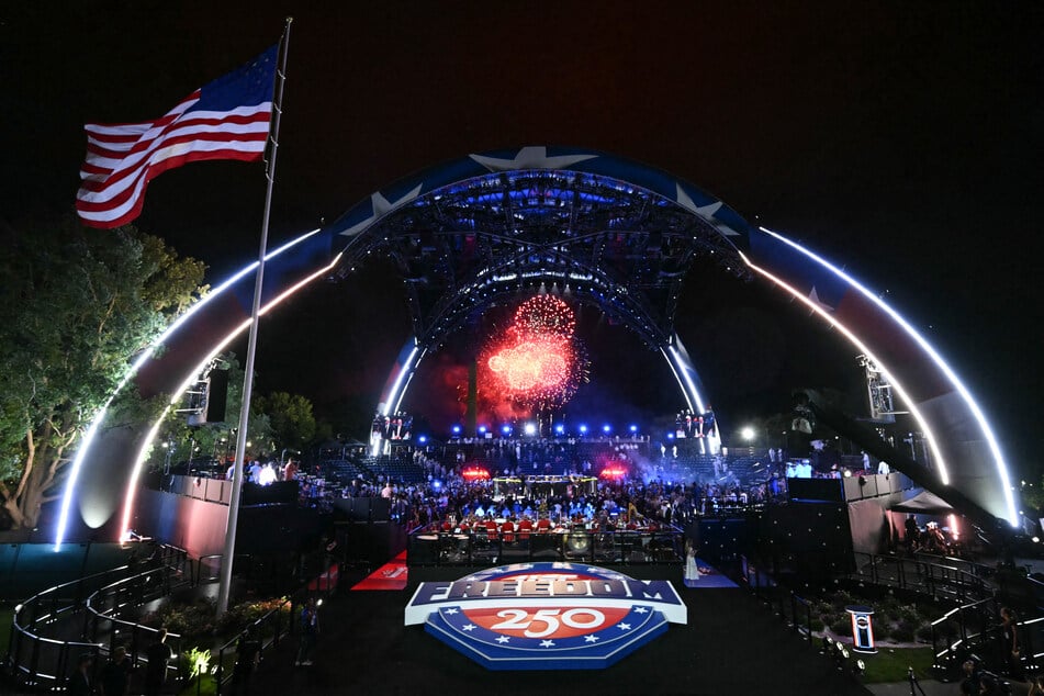 Fireworks go off as America's Justin Gaethje celebrates after defeating Georgia's Ilia Topuria during the "UFC Freedom 250" mixed martial arts event on the South Lawn of the White House, in the early morning hours of June 15, 2026.