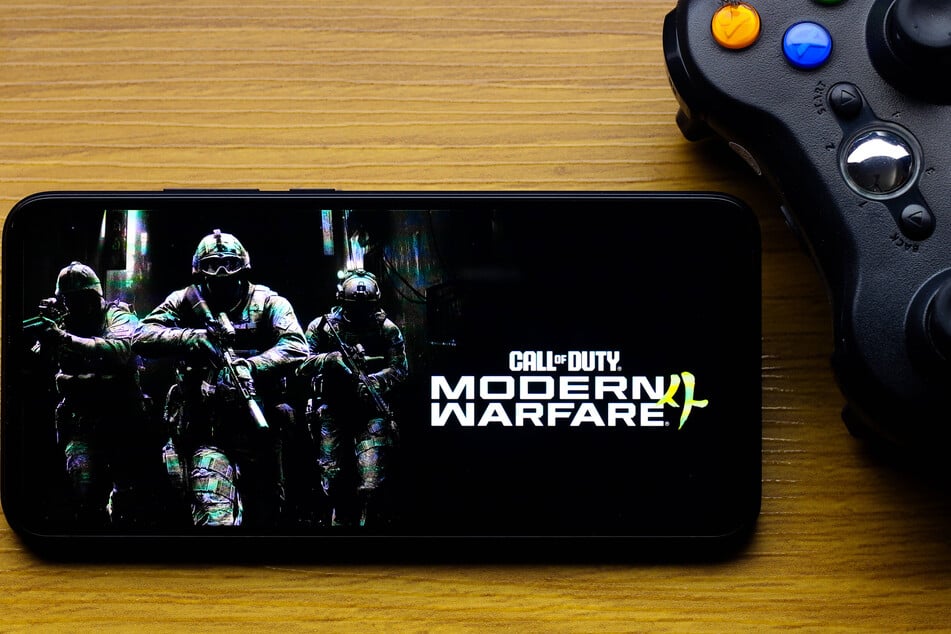 In this photo illustration, the Call of Duty: Modern Warfare 4 game logo is seen displayed on a smartphone screen next to an Xbox video game controller. The game faces big expectations after a lackluster predecessor.