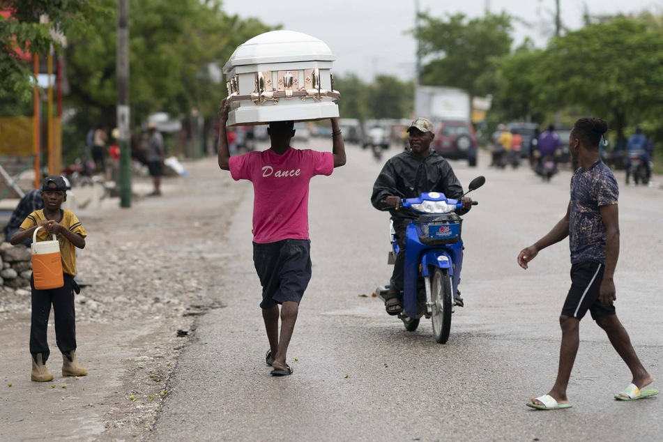 Haiti earthquake death toll climbs as tropical storm brings rains
