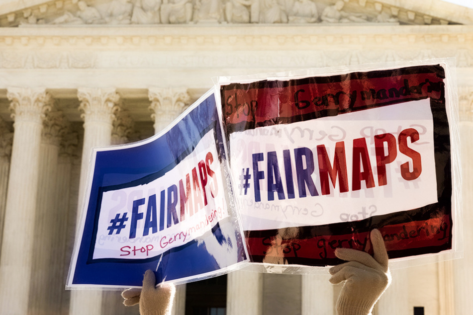Protesters gathered to rally against the manipulation of district lines outside the US Supreme Court on March 26, 2019.