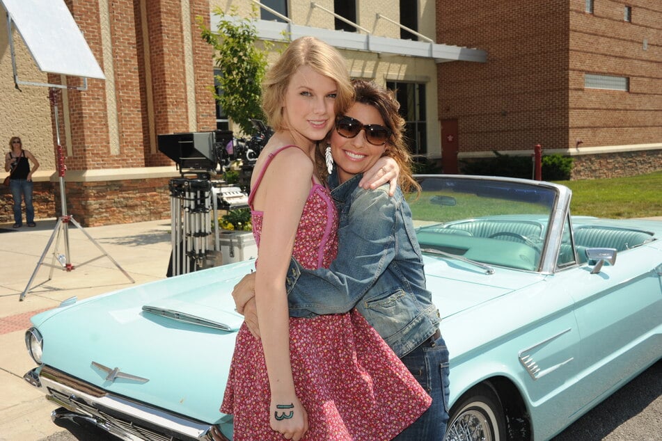 Shania Twain (r) spilled the tea on why she missed Taylor Swift's July 3 wedding.