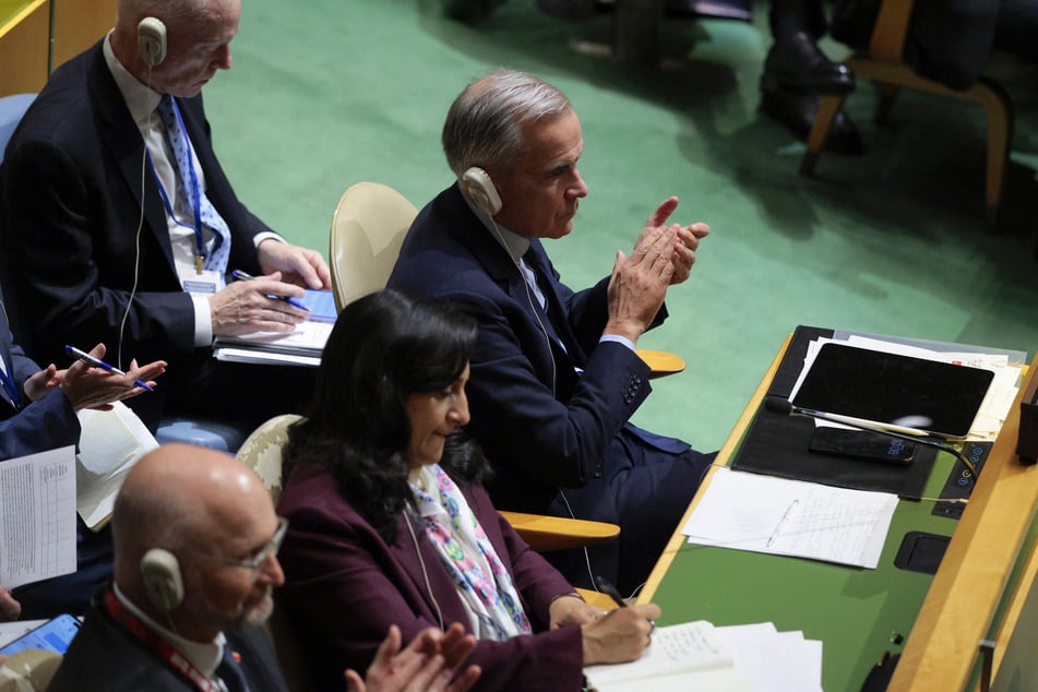Canadian Prime Minister Mark Carney (r) sits alongside his foreign minister, Anita Anand, while attending the 81st session of the United Nations General Assembly on Tuesday.