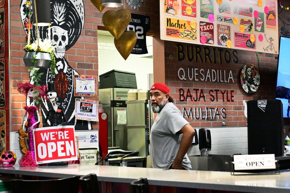 Restaurant owner and former police officer Antonio Munoz waits for customers at his restaurant in Las Vegas, Nevada, on August 20, 2026.