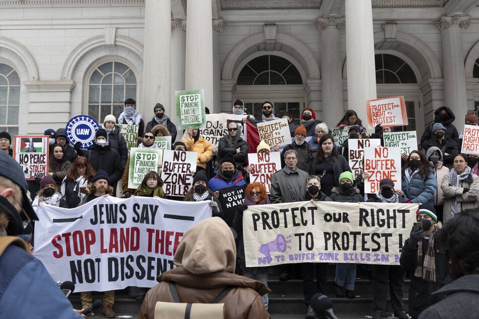 A coalition of organizations rallies on the steps of New York City Hall in opposition to proposed bills banning protests in buffer zones near places of religious worship and buildings affiliated with educational facilities on February 25, 2026.