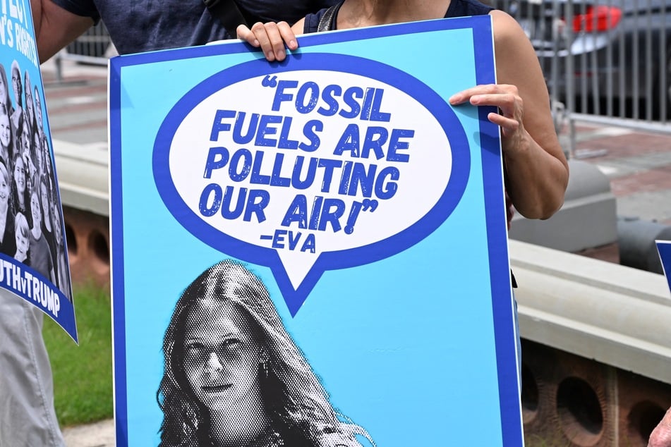 A protester holds a sign with a quote from Eva Lighthiser during a protest at the US Capitol in Washington DC on July 16, 2025.