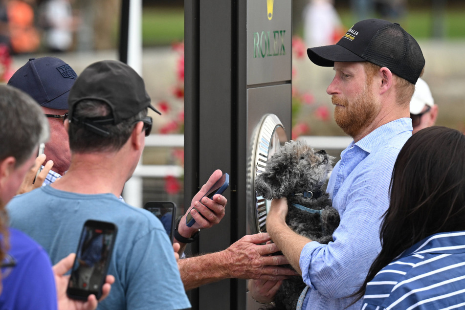 At first, Prince Harry doesn't want to keep the dog, ...