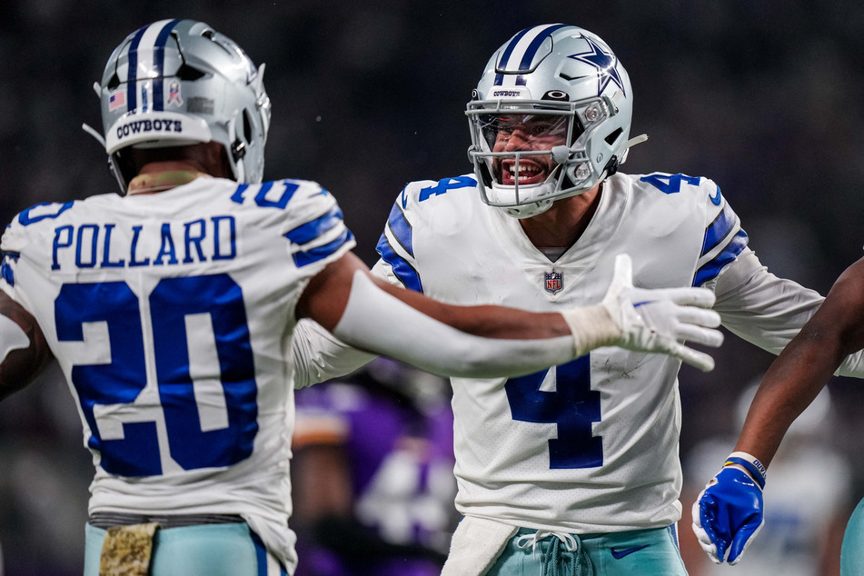 Dallas Cowboys quarterback Dak Prescott celebrates a touchdown with running back Tony Pollard during the third quarter against the Minnesota Vikings at US Bank Stadium.