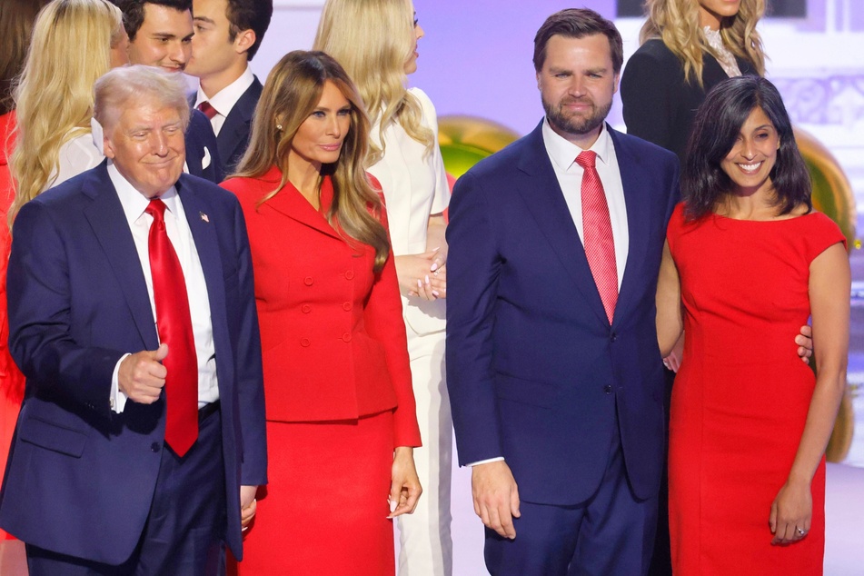 Republican Presidential nominee Donald Trump and his wife Melania are joined on stage by his running mate, JD Vance, and his wife, Usha, during the Republican National Convention on July 18, 2024.