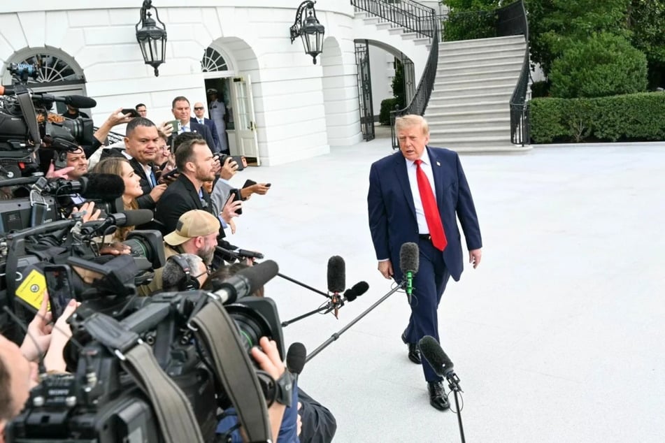 President Donald Trump speaks to members of the press at the White House in Washington, DC, on September 26, 2026. The Justice Department is reportedly investigating 5 media outlets that boycotted covering President Donald Trump after he banned outlets from the White House.