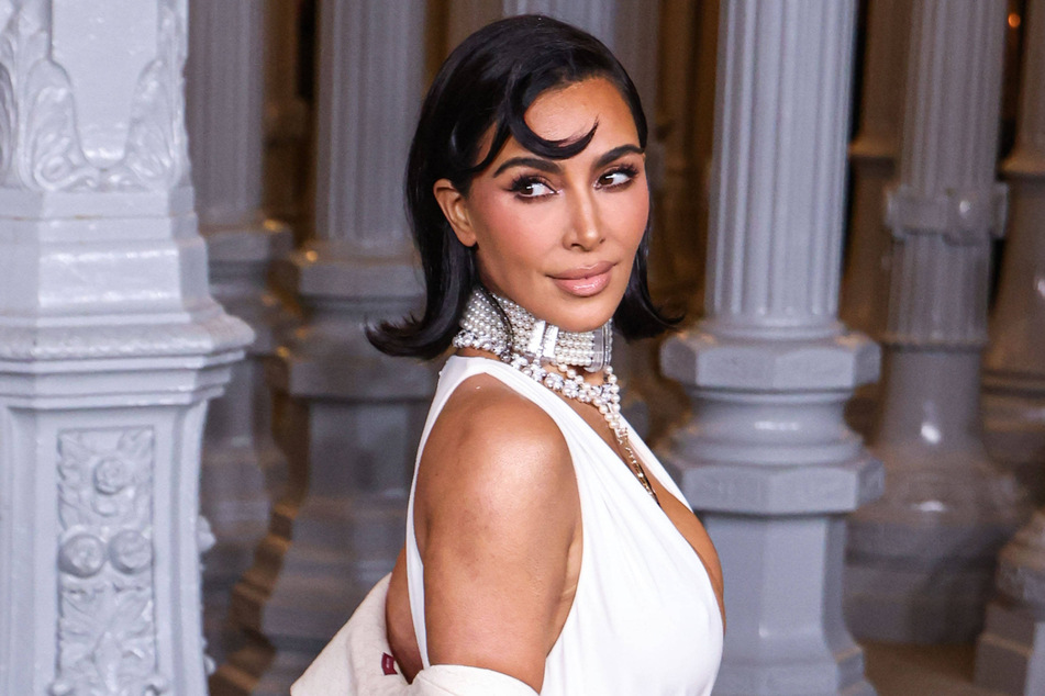 Kim Kardashian has stirred up controversy after rocking a rosary in her new SKIMs x Dolce & Gabbana campaign.