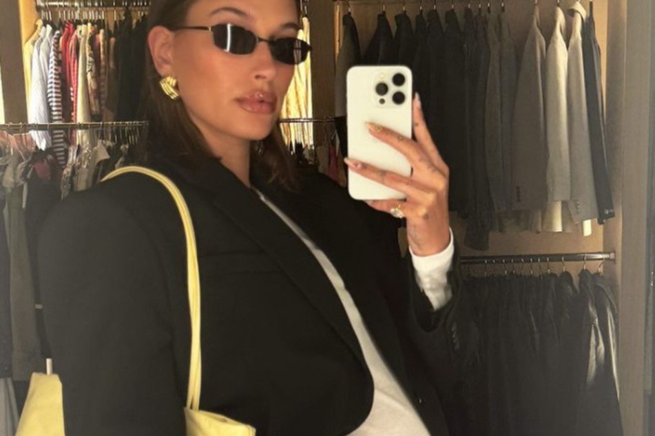 Hailey Bieber continued her trendy maternity style while showing off her growing baby bump.