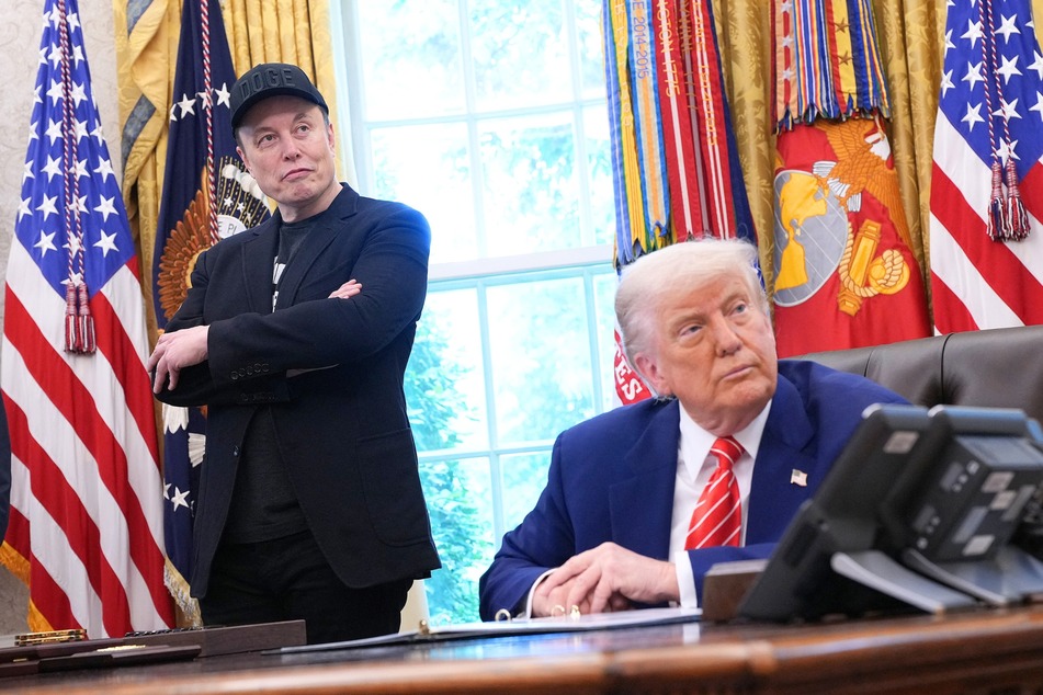 Elon Musk (l.) and President Donald Trump (r.) listen to questions from reporters in the Oval Office of the White House in Washington DC on May 30, 2025.
