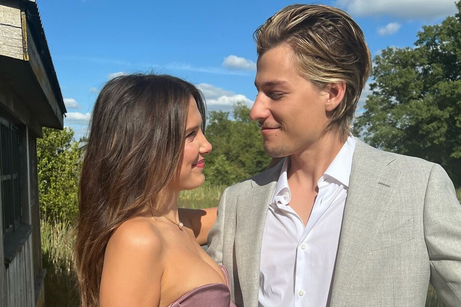 Millie Bobby Brown (l.) gushed over her "forever wedding date" in an adorable new photo with Jake Bongiovi.
