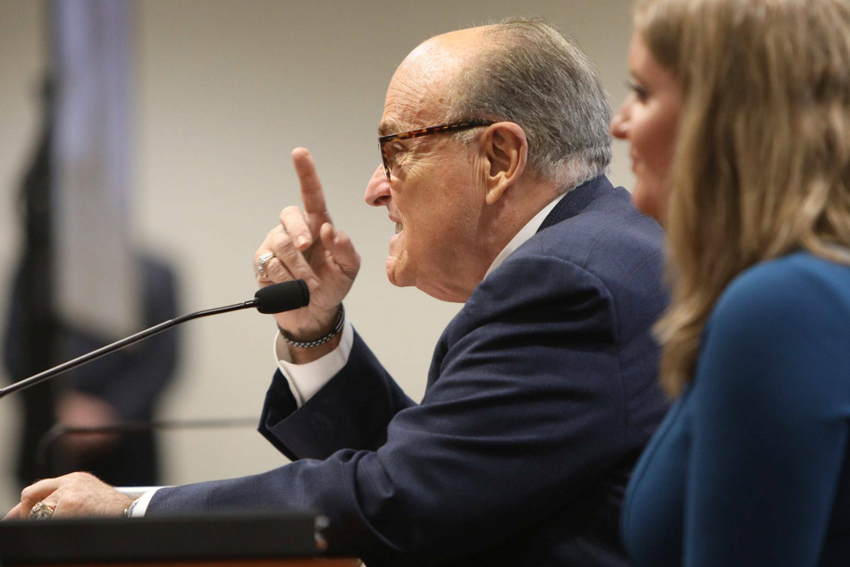 Rudy Giuliani repeatedly called Dominion "a company that specializes in voter fraud."