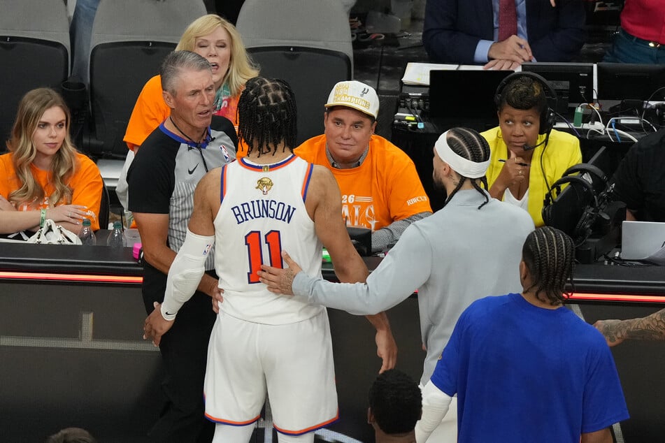 New York Knicks guard Jalen Brunson reacts toward a fan in the second half during game one of the 2026 NBA Finals at Frost Bank Center.