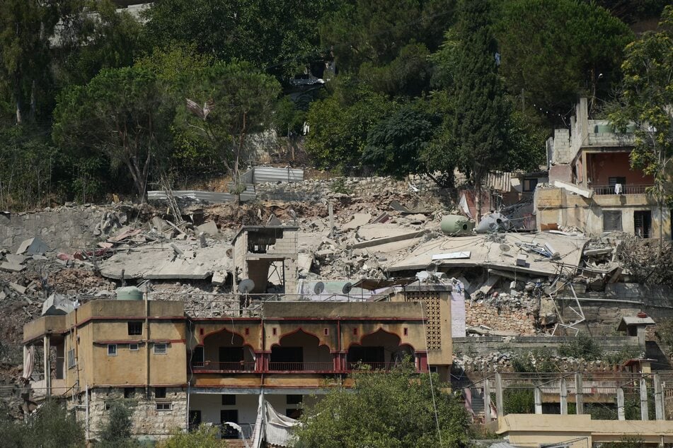 The rubble and debris of flattened buildings litter the hillside following an Israeli airstrike that targeted a neighborhood in the southern Lebanese village of Nabatieh al-Fawqa on August 15, 2026.