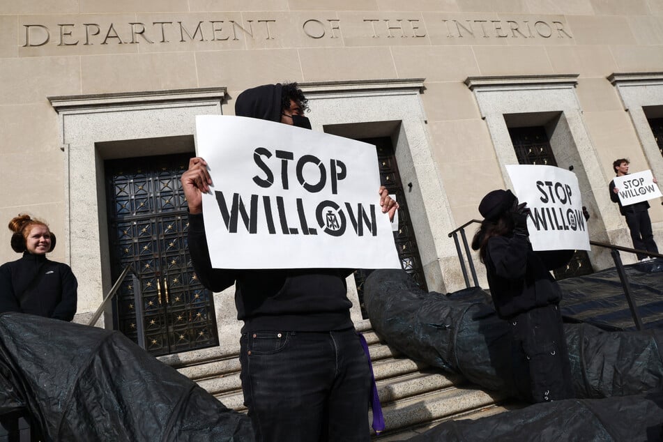 Activists hold a demonstration urging President Biden to reject the Willow Project at the US Department of Interior on November 17, 2022, in Washington DC.