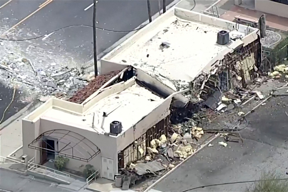Debris is spilled onto the street after a bomb exploded near a reproductive health facility in Palm Springs, California, on May 17, 2025.