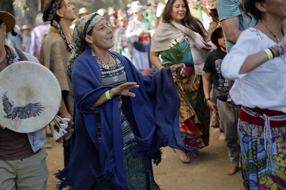 An Indigenous leader performs during a kiva, an ancestral ceremony of the pre-Columbian Anasazi culture, in Graneros, Chile.