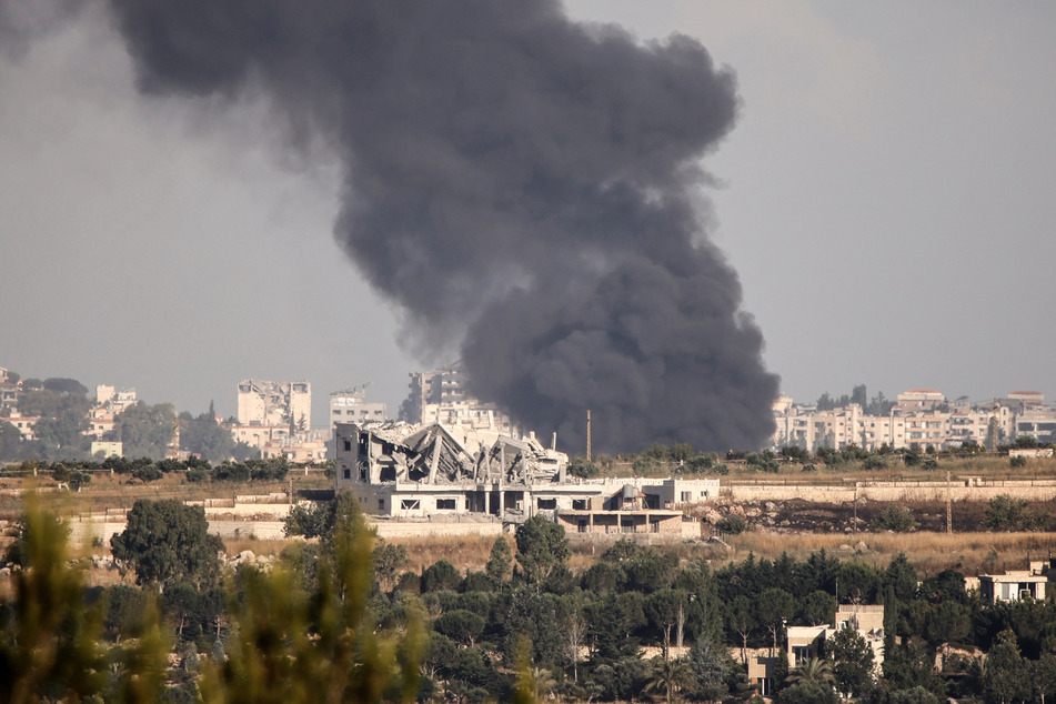 Smoke rises after Israeli artillery shelled a village in southern Lebanon on Monday, despite a newly announced peace deal.
