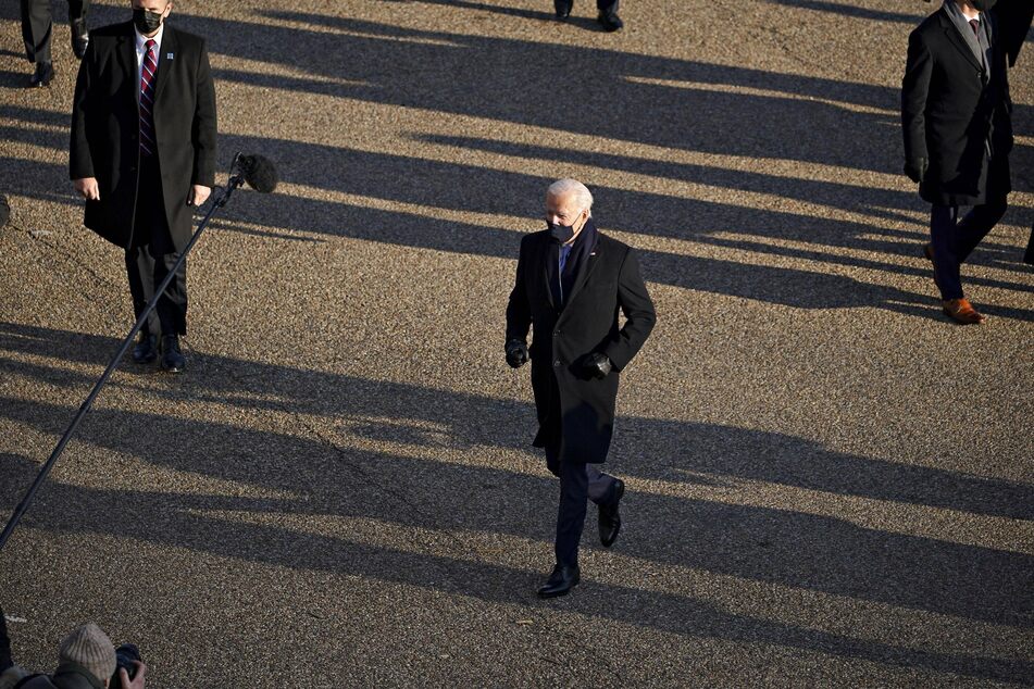 Biden often veered off-route to greet reporters and supporters lining Pennsylvania Avenue.