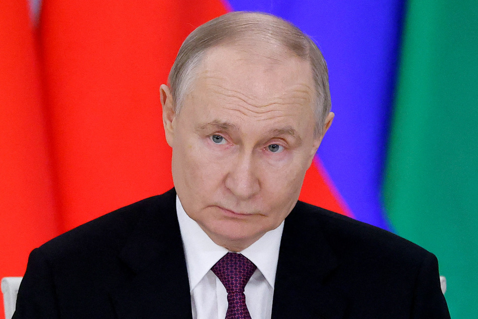 Russian President Vladimir Putin said Thursday he backed the idea of a truce with Ukraine, but said he had "serious questions" about how it would be implemented.