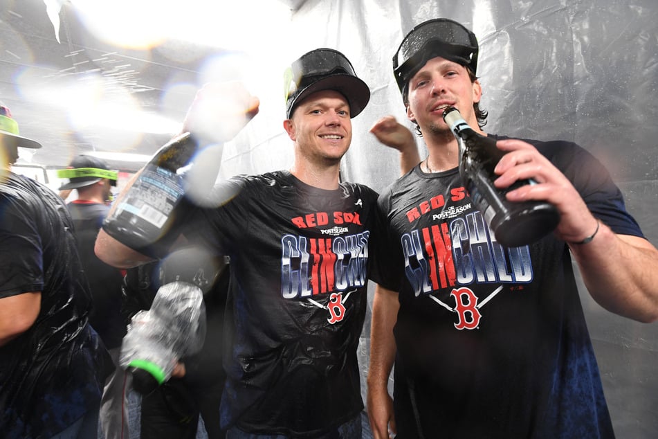 Sonny Gray (l.) and Adley Rutschman (r.) of the Boston Red Sox celebrate clinching an AL wild card spot following a loss to the Tampa Bay Rays at Tropicana Field on September 20, 2026.