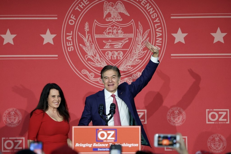 Republican US Senate candidate Dr. Mehmet Oz celebrates with his wife Lisa Oz during an election night event at the Newtown Athletic Club.