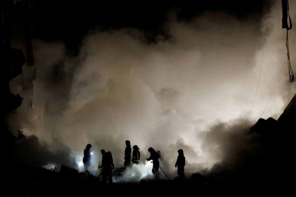 Emergency personnel in Dnipro worked through the night to help free people trapped under the rubble.