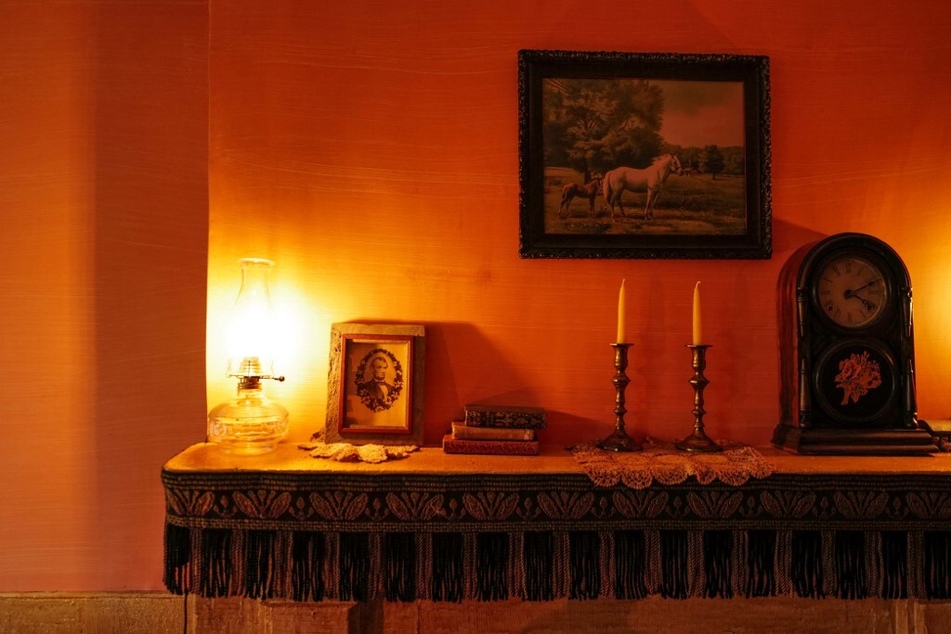 A portrait of President Abraham Lincoln sits on the mantelpiece of the Joseph and Rachel Moore home exhibit.