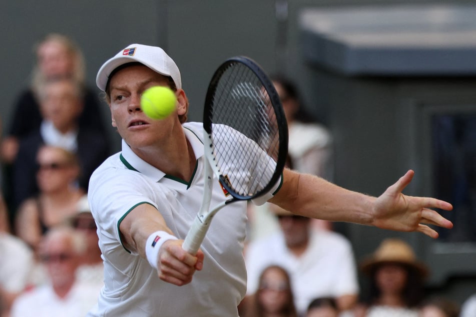 Jannik Sinner in action during his Wimbledon final match against Germany's Alexander Zverev.