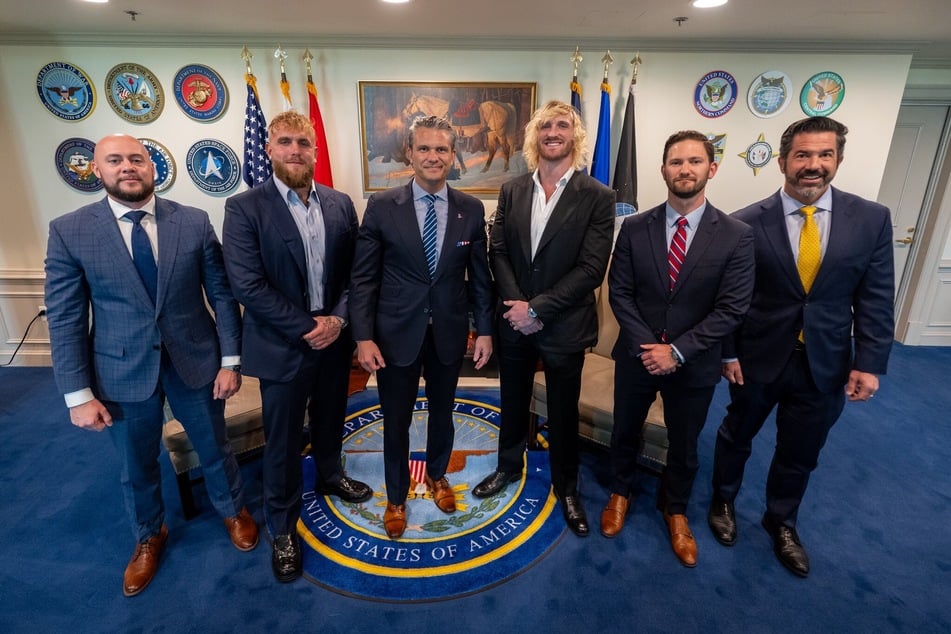 Social media influencers Jake Paul (2nd l) and Logan Paul (3rd r) met with Defense Secretary Pete Hegseth (3rd l) at the Pentagon last week and addressed a room full of service members.