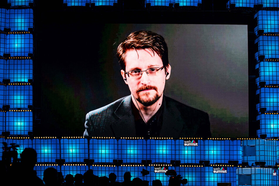 Edward Snowden speaks from Russia to the audience during the annual Web Summit technology conference in Lisbon in 2019.