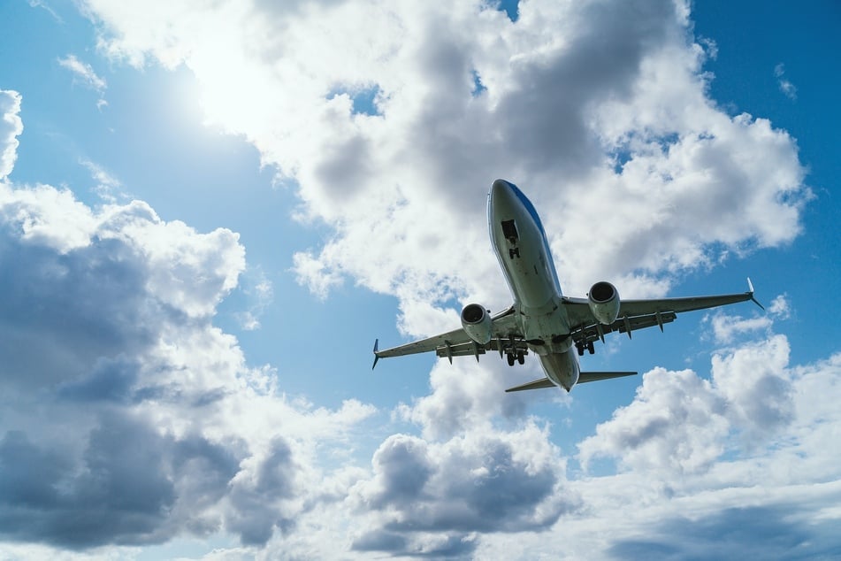 An off-duty pilot was booked Monday on 83 counts of attempted murder after allegedly trying to "disrupt the operations" of the engines of a plane he was aboard.