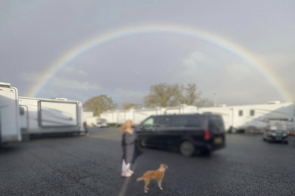Ariana Grande shared a behind-the-scenes photo on Instagram marking the halfway point of filming Wicked.