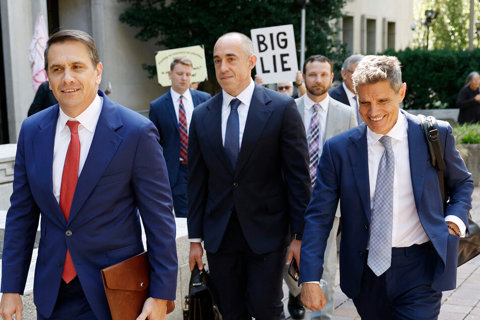 Trump’s attorneys (from l. to r.) Todd Blanche, Emil Bove, and John Lauro depart federal court after a hearing on the election interference case on Thursday.