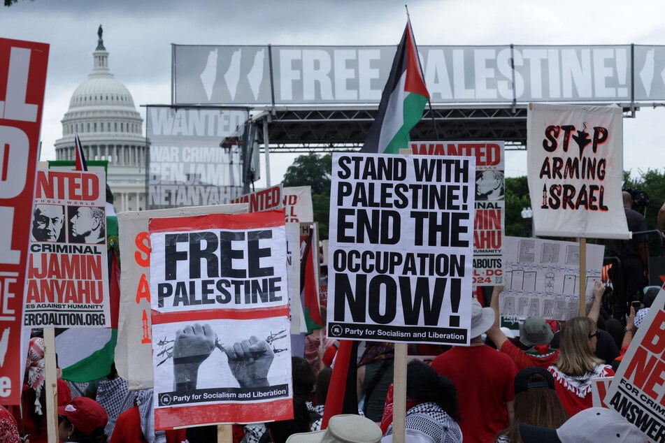 Demonstrators for Palestinian liberation protest the US government's continued support for Israel near the US Capitol in Washington DC.