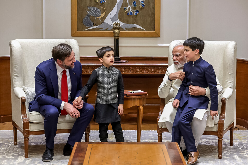 In this handout photograph taken on Monday, and released by the Indian Press Information Bureau (PIB), India’s Prime Minister Narendra Modi (2nd from r) speaks with US Vice President JD Vance (l.) along with his children, during their meeting in New Delhi.
