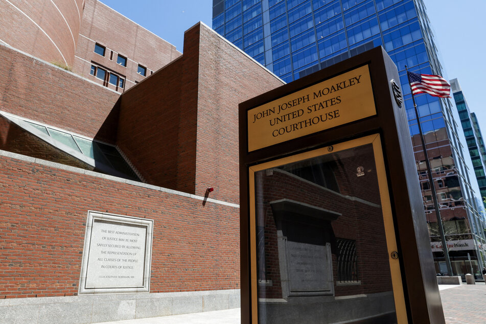 A US flag waves outside the federal courthouse in Boston, Massachusetts, where a judge temporarily blocked the Trump administration from deporting Asian migrants to Libya.
