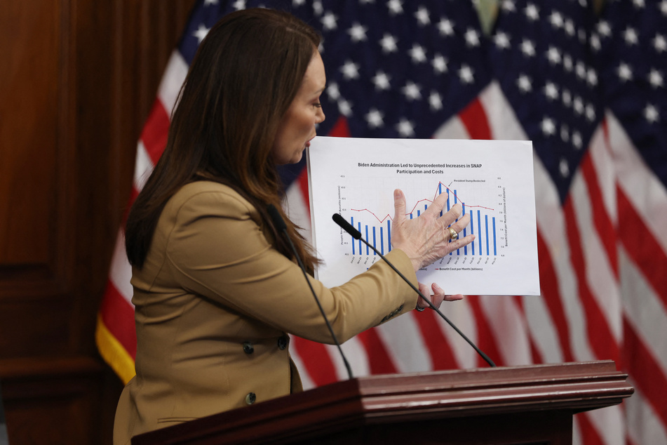 Agriculture Secretary Brooke Rollins points to a chart on SNAP benefits during a news conference on Capitol Hill on October 31, 2025.