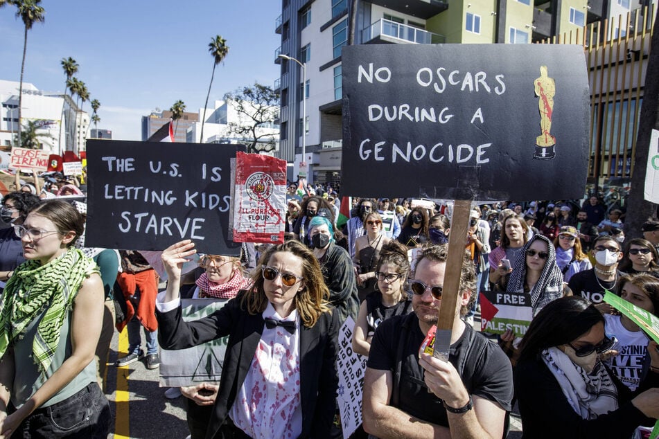 Demonstrators protest the US-backed Israeli bombardment and invasion of Gaza during the 96th Academy Awards in Los Angeles, California.