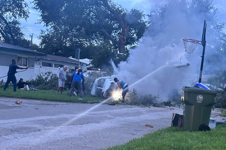 Nearby residents immediately rushed to help the injured people inside the plane and tried to free them.