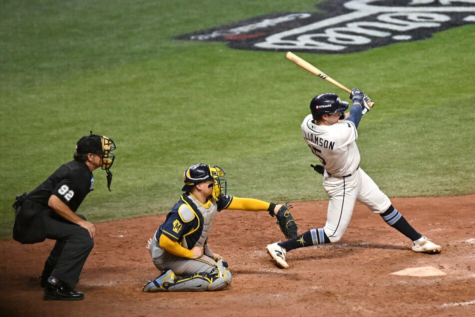 Tampa Bay Rays second baseman Ben Williamson hits a walk-off single against the Milwaukee Brewers during the twelfth inning in game four of the 2026 World Series at Tropicana Field.