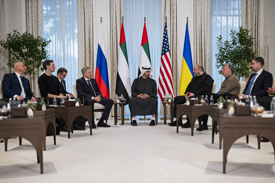 This handout photograph taken and released by the UAE Presidential Court on Friday shows UAE President Sheikh Mohamed bin Zayed al-Nahyan (c) speaking with the heads of delegations participating in the UAE-hosted trilateral talks between the US, Russia, and Ukraine, at the Al Shati Palace in Abu Dhabi.